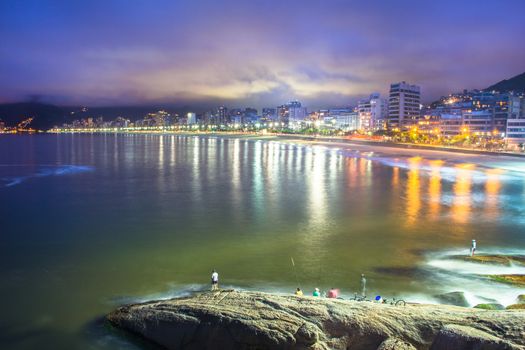 Fishermen fishing at the Ipanema beach, Rio de Janeiro, Brazil.