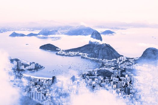 Rio de Janeiro, Brazil. Suggar Loaf and  Botafogo beach viewed from Corcovado atfter rainy sunrise.