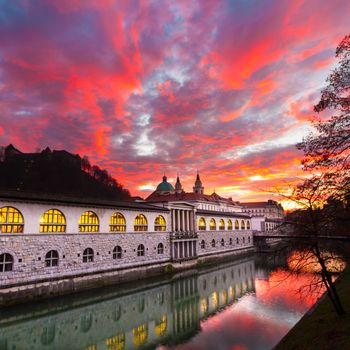 Ljubljana, Slovenia, Europe - Ljubljanica River and Central Market in sunset.  Ljubljana open market buildings was designed by famous architect Jo��e Plecnik.