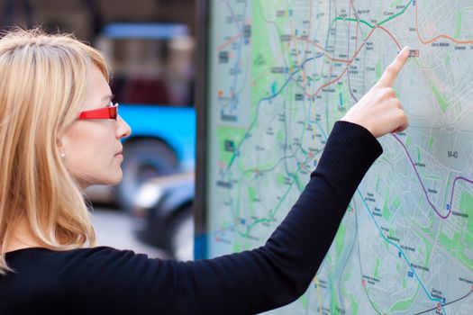 Woman orientating herself on the public transport map.