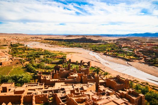 Ait Benhaddou is a fortified city, or ksar, along the former caravan route between the Sahara and Marrakech in present day Morocco. Situated in Souss Massa Draa on a hill along the Ounila River and is known for its kasbah.