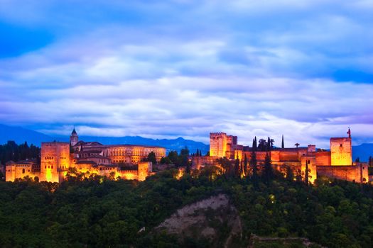 Evening panoramic view of Spain's main tourist attraction: ancient arabic fortress  of Alhambra, Granada, Spain.