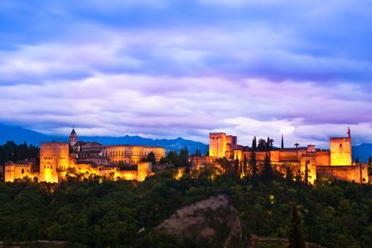 Evening panoramic view of Spain's main tourist attraction: ancient arabic fortress  of Alhambra, Granada, Spain.