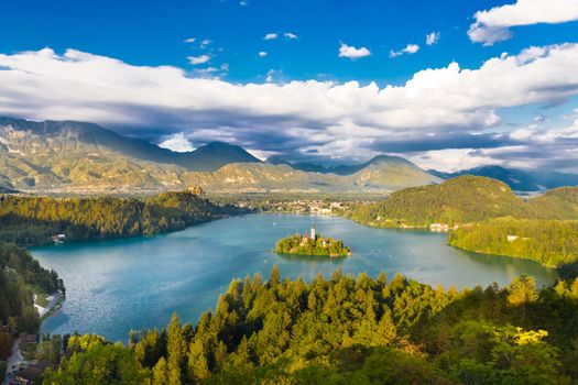 Panoramic view of  Julian Alps, Lake Bled with St. Mary��s Church of the Assumptionon on the small island; Bled, Slovenia, Europe.