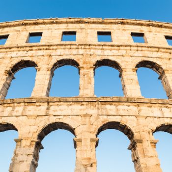 The Roman Amphitheater of Pula, Croatia shot at dusk. It was constructed in 27 - 68 AD and is among the six largest surviving Roman arenas in the World and best preserved ancient monument in Croatia.