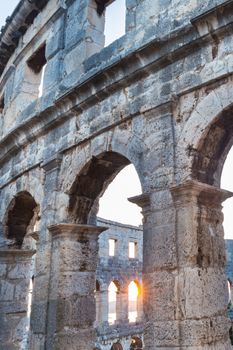 The Roman Amphitheater of Pula, Croatia shot at dusk. It was constructed in 27 - 68 AD and is among the six largest surviving Roman arenas in the World and best preserved ancient monument in Croatia.