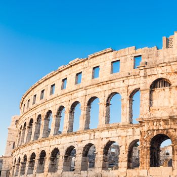 The Roman Amphitheater of Pula, Croatia shot at dusk. It was constructed in 27 - 68 AD and is among the six largest surviving Roman arenas in the World and best preserved ancient monument in Croatia.