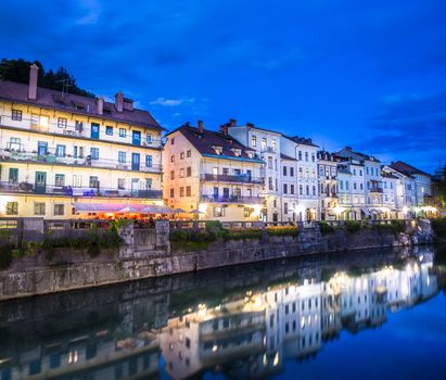 Romantic medieval Ljubljana's city center, the capital of Slovenia, Europe. Gallus bank of river Ljubljanica shot at dusk.