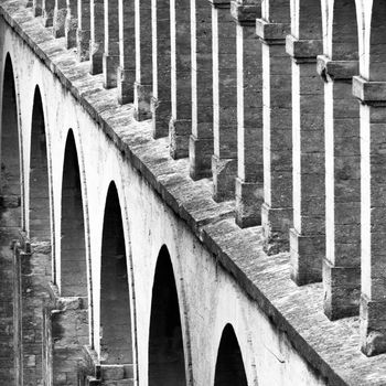 Architectural detail from the Saint Clement Aqueduct, Montpelier, France, shot in black and white.