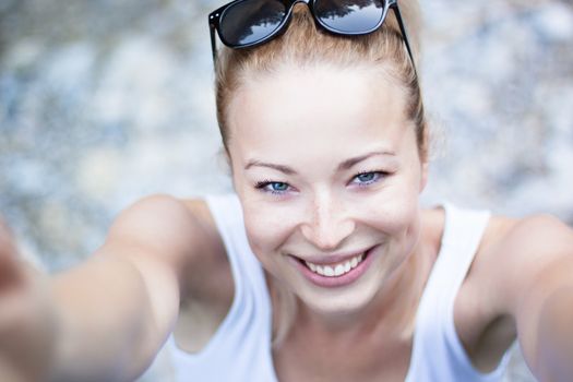 Self portrait of a active, young, woman on holidays.