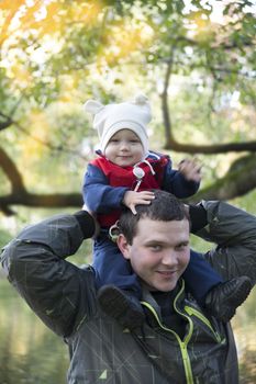 Dad with son on his shoulders for a walk