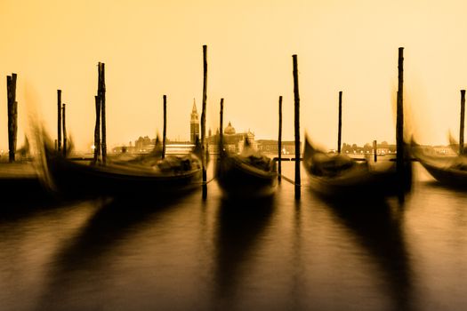 Venice in the evening light with gondolas on Grand Canal against San Giorgio Maggiore church. Italy, Europe. World heritage site.