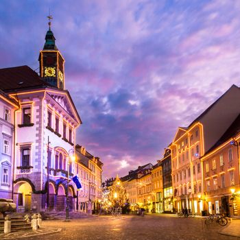 Romantic Ljubljana's city center, the capital of Slovenia, Europe. City hall and Roba's fountain shot at dusk.