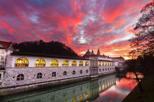 Ljubljana, Slovenia, Europe - Ljubljanica River and Central Market in sunset.  Ljubljana open market buildings was designed by famous architect Jo��e Plecnik.