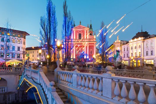 Romantic Ljubljana's city center  decorated for Christmas time. River Ljubljanica, Triple Bridge (Tromostovje) and  Preseren's square; Ljubljana, Slovenia, Europe.