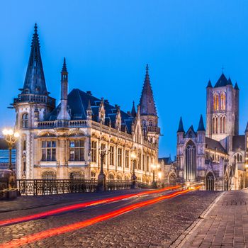 Picturesque medieval buildings around Korenmarkt square ( Saint Nicholas' Church, The Celtic Towers,... ) overlooking the Leie river in Ghent town, Belgium, Europe.