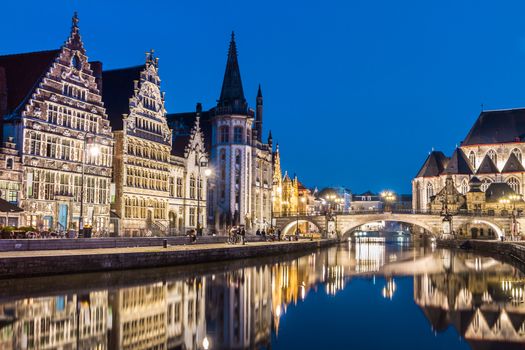 Picturesque medieval buildings overlooking the "Graslei harbor" on Leie river in Ghent town, Belgium, Europe.