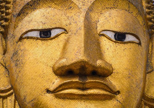 Golden Buddha statue at buddhist temple in Bangkok.