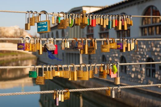 Love locks locked on the fence of the bridge in Ljubljana, Slovenia