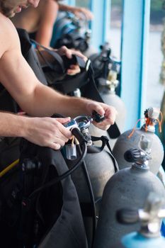 Dive master checking the diving equipment.