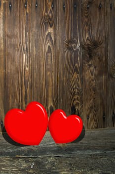 Two hearts on a wooden scene, a Valentines theme.