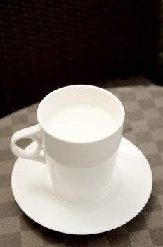 Hot milk cup on table