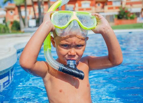 Activities on the pool. Cute boy in swimming pool