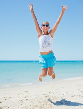 Beautiful happy smiling girl on beach vacation