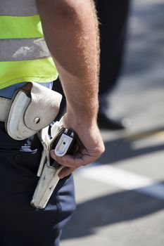 Police officer with handgun on his holster