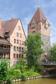 Vordere Insel Schütt, Schuldturm Tower or Debtors Prison and Heubrücke Bridge over the River Pegnitz in Nuremberg, Middle Franconia, Bavaria, Germany, Central Europe.