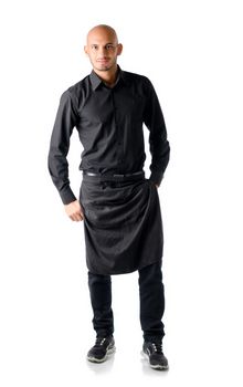 Handsome bald young restaurant or bar waiter, standing isolated on white background, smiling