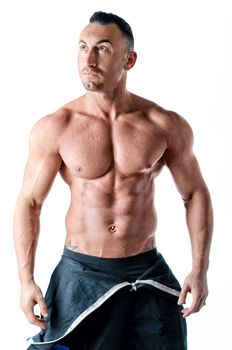 Muscular shirtless worker with coverall around waist, isolated on white