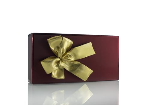 golden bow on red present isolated on white