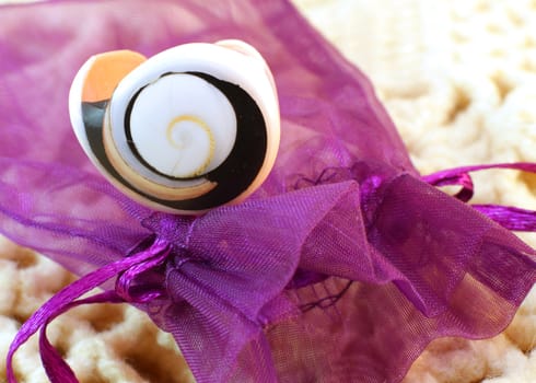 Original handmade ring of sea shell on the knitted background