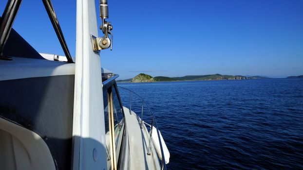 White boat floats on the Japanese sea