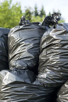 A pile of black garbage bags