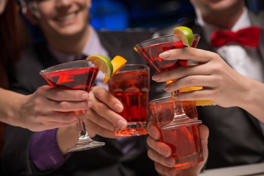 close-up of hands with glasses, a toast, party with friends