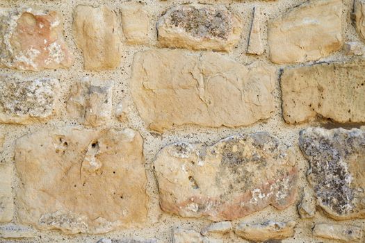 Antique wall of old rough stone, texture background.