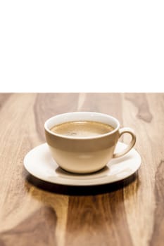 A cup of coffee with on a wooden background