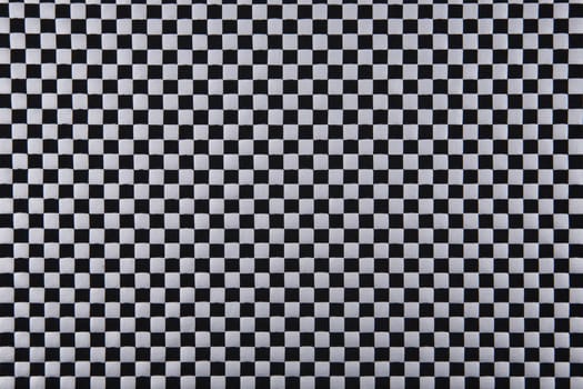 The material into a small, silver and black grid, a background