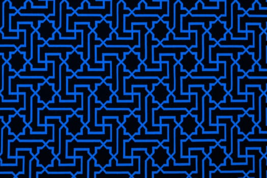 The material in geometric patterns, a blue textile background.