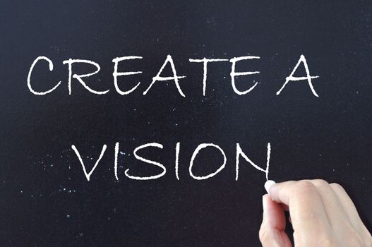 Create a vision handwritten on a chalkboard 