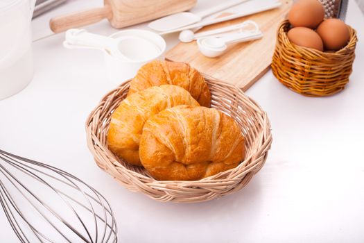 Fresh croissant Placed on the table along with equipment for the bakery.