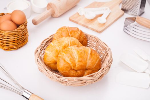 Fresh croissant Placed on the table along with equipment for the bakery.