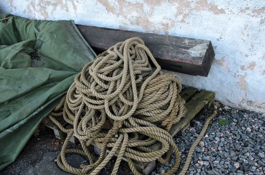 a pallet with a rope on the pitch in front of house