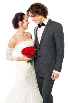 Young couple admiring each other, studio shot.