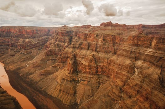 Grand Colorado Canyon in red color on a cloudy day 2013
