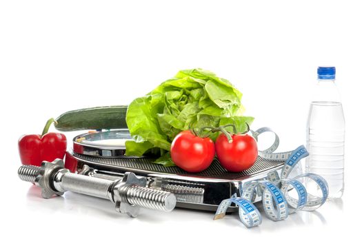 a weighing scale with vegetables, water and a dumbbell on a white background