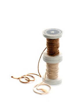 two spools of rope on a white background