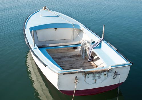 old little boat on the calm sea